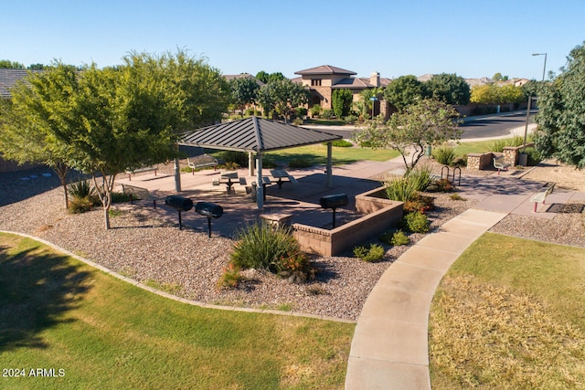 view of property's community featuring a yard and a gazebo