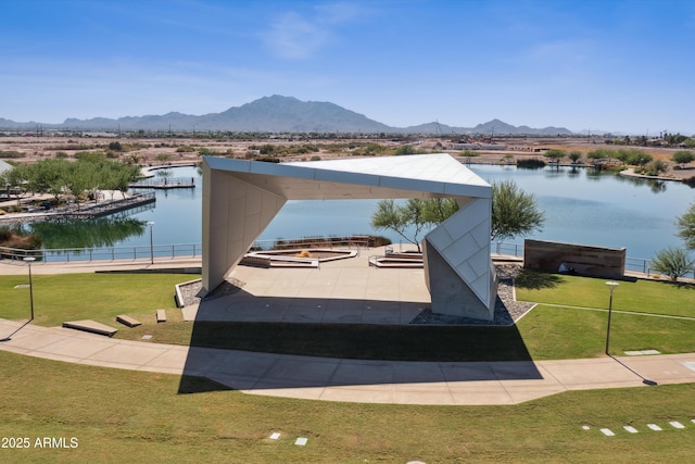 exterior space featuring a water and mountain view