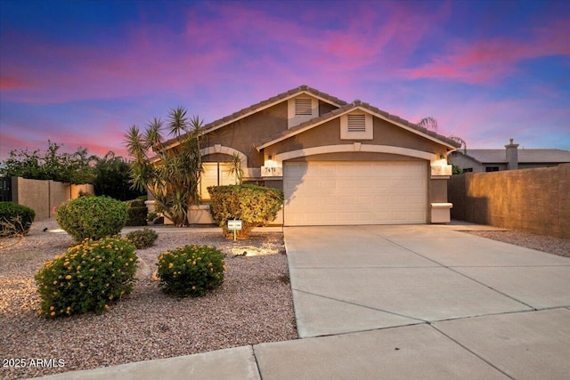 7471 E Desert Vista Rd, Scottsdale, AZ 85255 - view of front of home with stucco siding, driveway, fence, and an attached garage