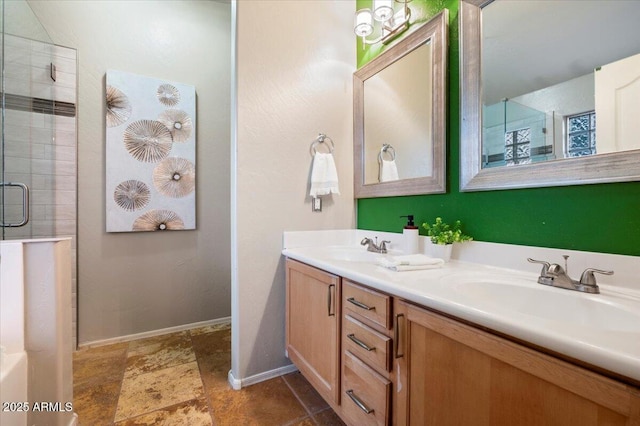 7471 E Desert Vista Rd, Scottsdale, AZ 85255 - bathroom featuring double vanity, a sink, baseboards, and an enclosed shower