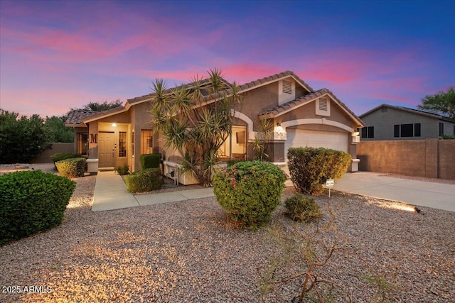 7471 E Desert Vista Rd, Scottsdale, AZ 85255 - view of front facade with stucco siding, fence, a tiled roof, driveway, and a garage