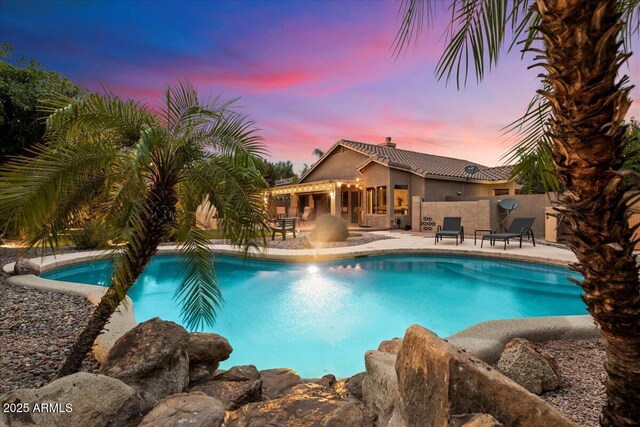 7471 E Desert Vista Rd, Scottsdale, AZ 85255 - pool at dusk with a patio and an outdoor pool