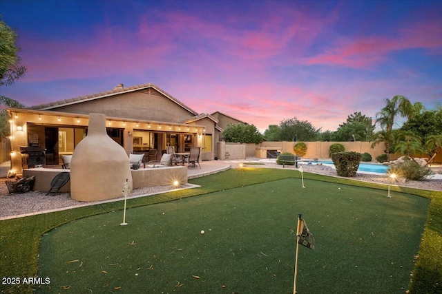 7471 E Desert Vista Rd, Scottsdale, AZ 85255 - back of house featuring a tile roof, stucco siding, a fenced backyard, a fenced in pool, and a patio area