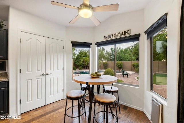 7471 E Desert Vista Rd, Scottsdale, AZ 85255 - dining area with baseboards, ceiling fan, and wood finished floors