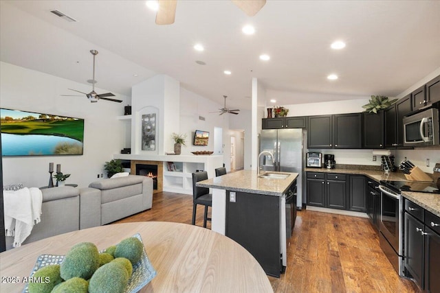 7471 E Desert Vista Rd, Scottsdale, AZ 85255 - kitchen with a sink, appliances with stainless steel finishes, lofted ceiling, visible vents, and ceiling fan