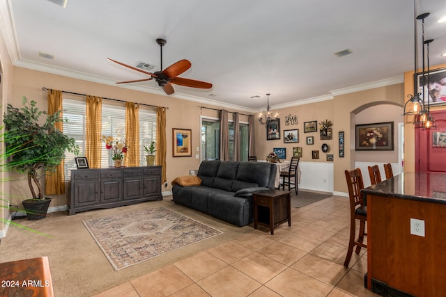 tiled living room featuring ceiling fan and ornamental molding