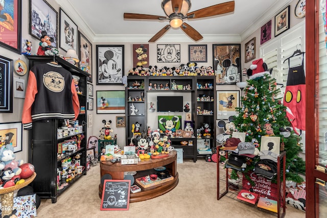 interior space with carpet flooring, crown molding, and ceiling fan