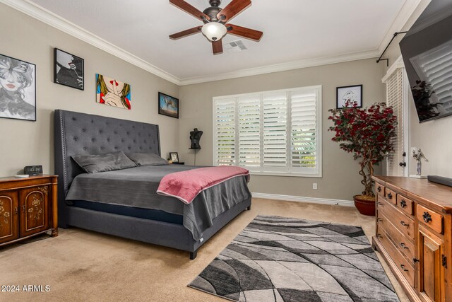 carpeted bedroom featuring ornamental molding and ceiling fan