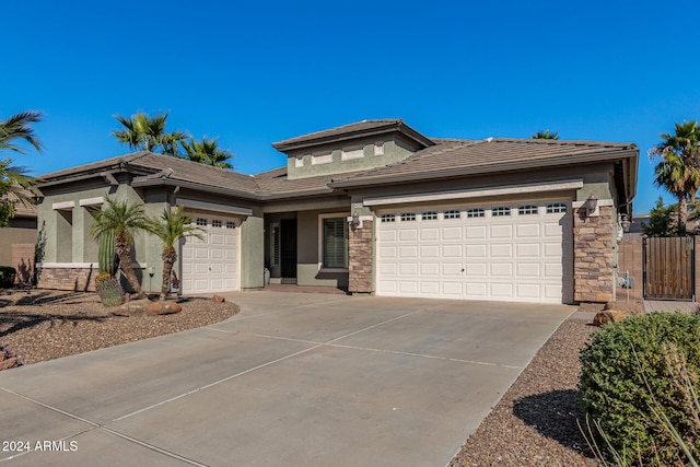 prairie-style home featuring a garage