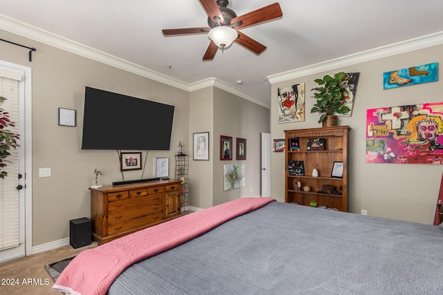 carpeted bedroom with ceiling fan and crown molding