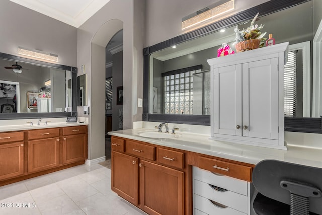 bathroom with tile patterned floors, plenty of natural light, vanity, crown molding, and ceiling fan