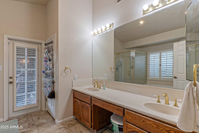 bathroom featuring walk in shower and vanity