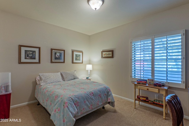 bedroom featuring light colored carpet