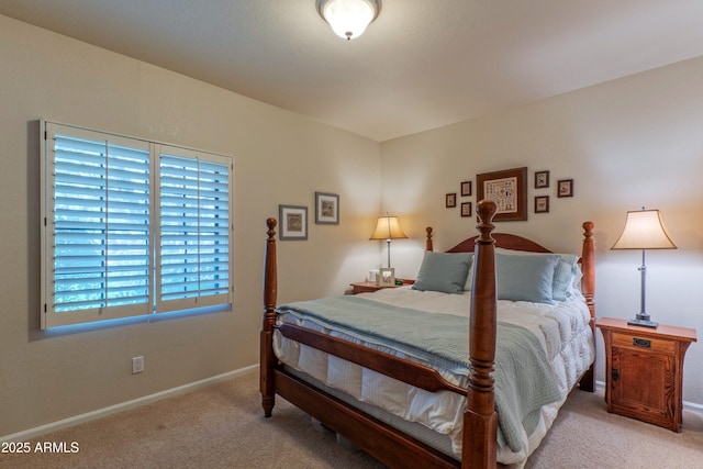 bedroom featuring light carpet