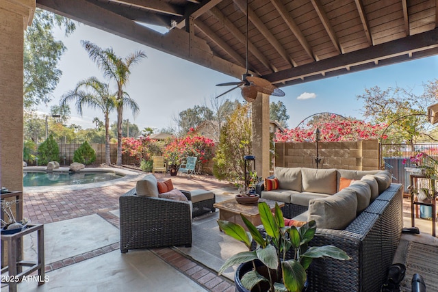 view of patio featuring a fenced in pool, an outdoor hangout area, and ceiling fan