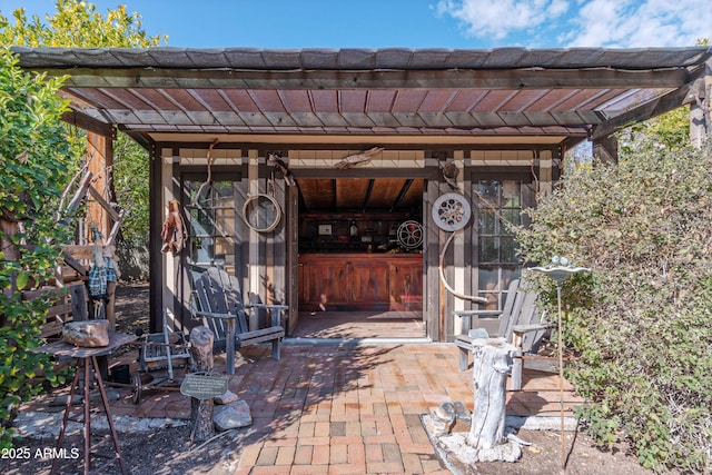 view of patio with an outdoor structure