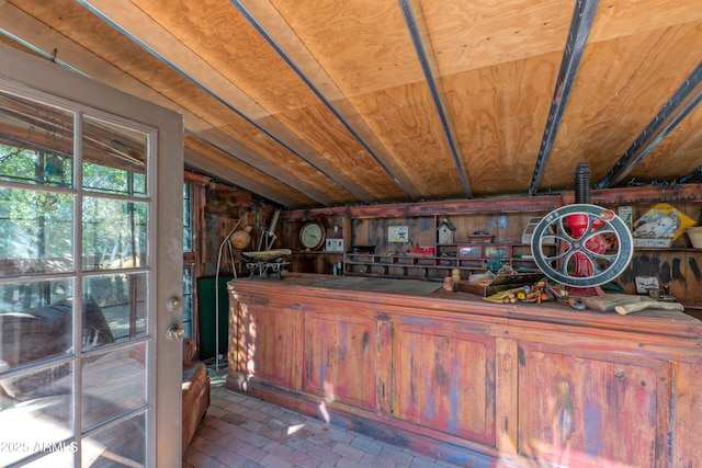 bar with vaulted ceiling and wooden ceiling