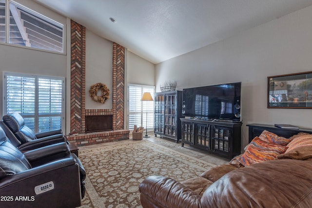 living room with high vaulted ceiling and a brick fireplace