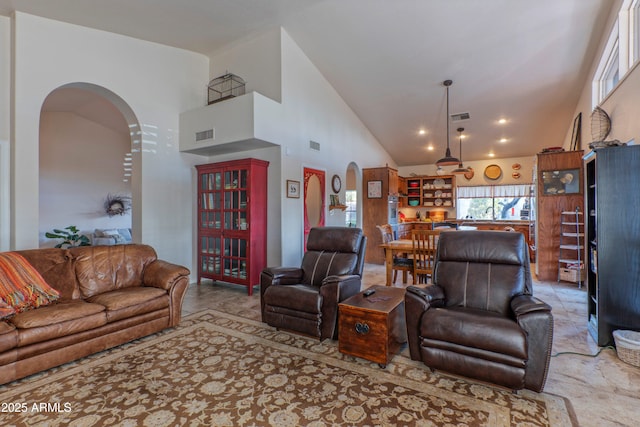 living room with a high ceiling