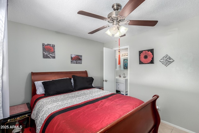 711 E Laurel Dr Unit 17, Casa Grande, AZ 85122 - bedroom featuring a sink, light tile patterned floors, a ceiling fan, and a textured ceiling