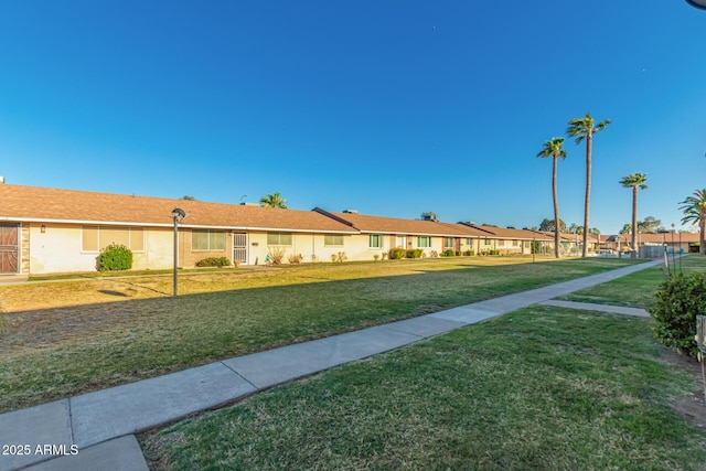 711 E Laurel Dr Unit 17, Casa Grande, AZ 85122 - view of front facade with a residential view and a front lawn