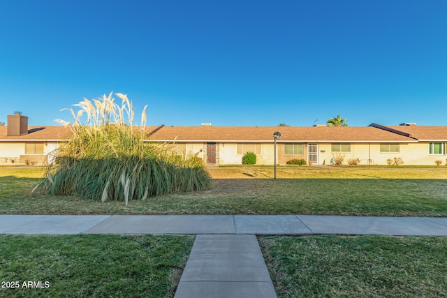 711 E Laurel Dr Unit 17, Casa Grande, AZ 85122 - ranch-style home with a front yard and stucco siding