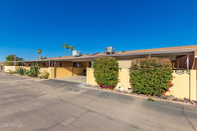 711 E Laurel Dr Unit 17, Casa Grande, AZ 85122 - view of front of house with central air condition unit and fence