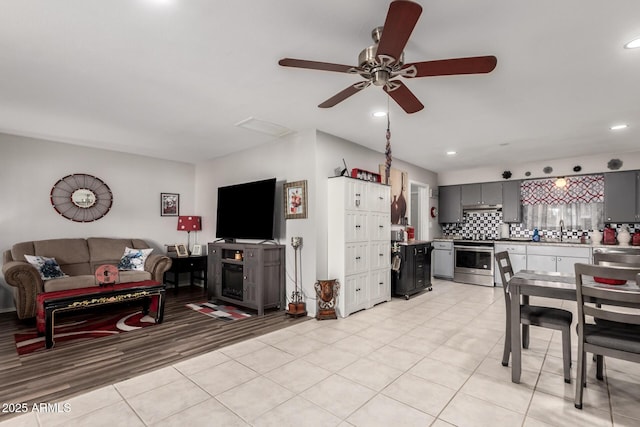 711 E Laurel Dr Unit 17, Casa Grande, AZ 85122 - living area with light tile patterned floors, recessed lighting, and ceiling fan