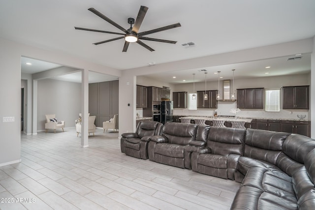 living room featuring ceiling fan