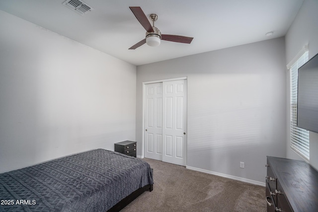 bedroom with carpet flooring, ceiling fan, and a closet