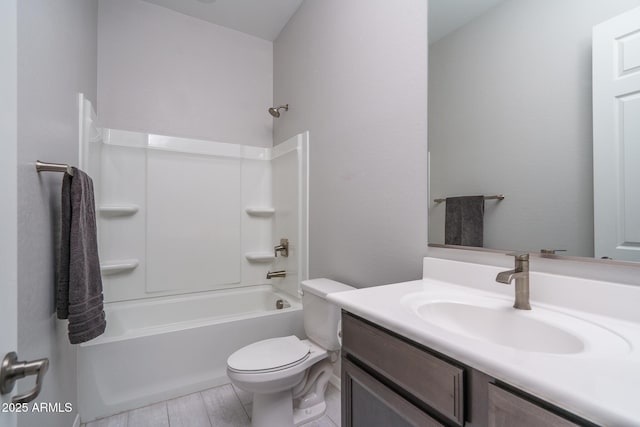 full bathroom with vanity, washtub / shower combination, and toilet