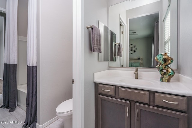 full bathroom with vanity, tile patterned floors, toilet, and shower / bath combo with shower curtain