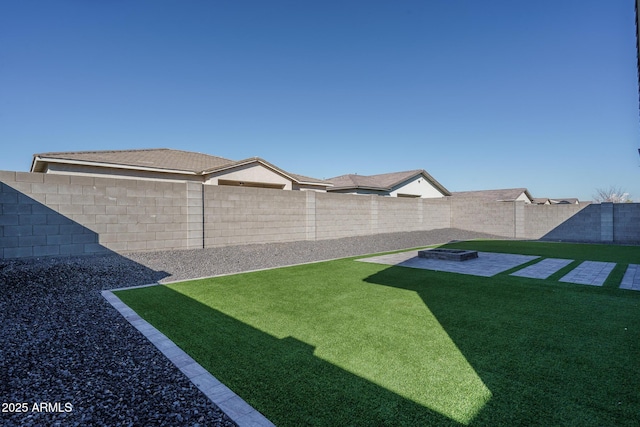 view of yard with an outdoor fire pit