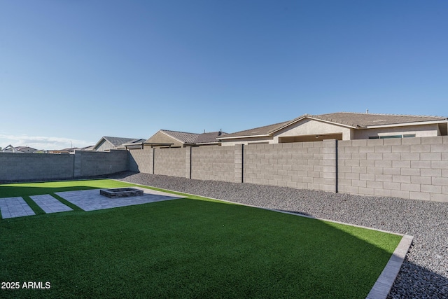 view of yard featuring a patio area and a fire pit