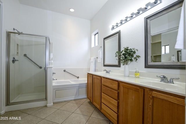 full bathroom with double vanity, a sink, tile patterned flooring, a shower stall, and a bath