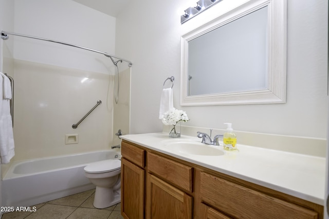 bathroom featuring tile patterned floors, washtub / shower combination, toilet, and vanity