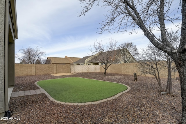 view of yard featuring a fenced backyard