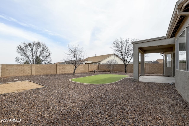 view of yard featuring a fenced backyard and a patio area