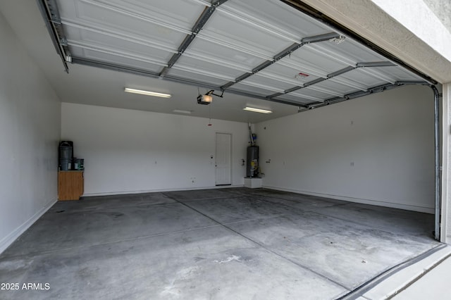 garage with a garage door opener and water heater