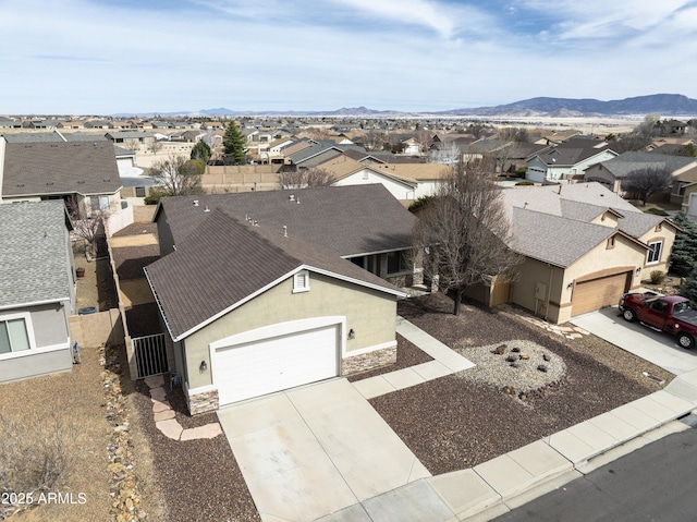 drone / aerial view with a residential view and a mountain view