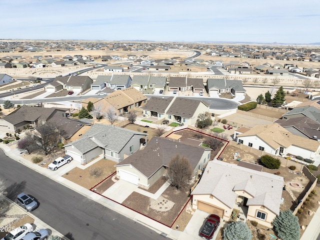 birds eye view of property with a residential view