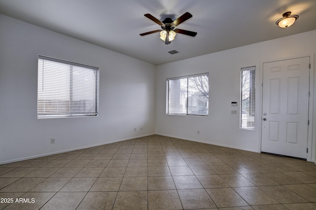 entrance foyer featuring light tile patterned floors, visible vents, baseboards, and ceiling fan