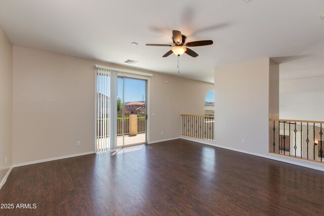 7421 S 25th Ln, Phoenix, AZ 85041 - empty room with plenty of natural light, ceiling fan, wood finished floors, and baseboards