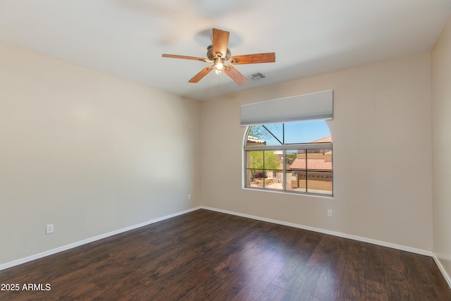 7421 S 25th Ln, Phoenix, AZ 85041 - empty room featuring wood finished floors, a ceiling fan, and baseboards