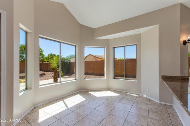 7421 S 25th Ln, Phoenix, AZ 85041 - unfurnished sunroom with high vaulted ceiling, tile patterned floors, and baseboards
