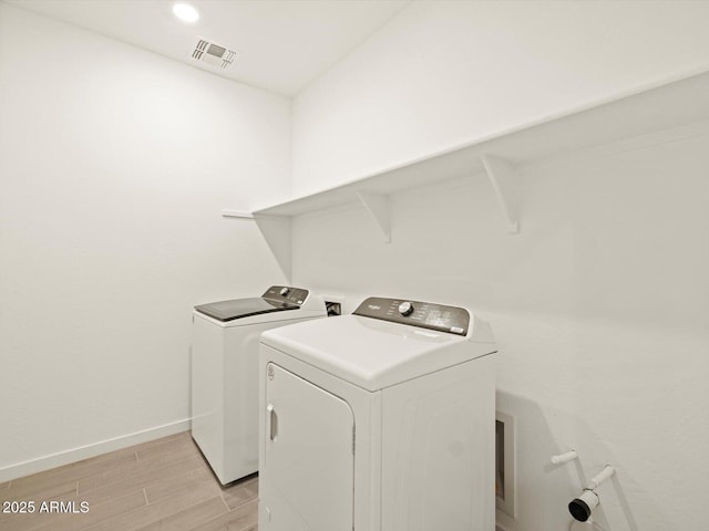 laundry area featuring independent washer and dryer