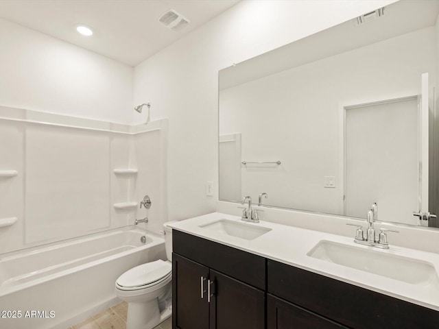 full bathroom featuring vanity, tub / shower combination, wood-type flooring, and toilet