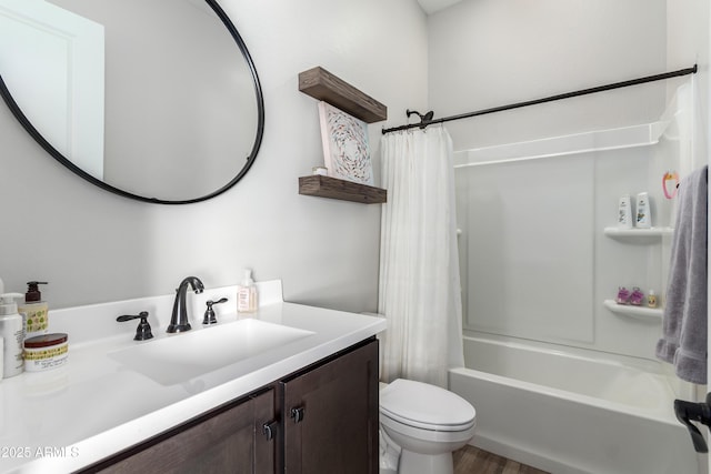 bathroom with shower / bath combination with curtain, vanity, and toilet