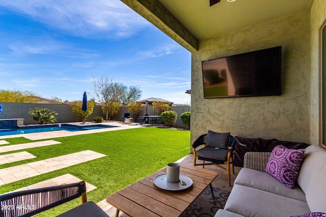 view of yard featuring a fenced in pool, a patio area, a fenced backyard, and an outdoor hangout area