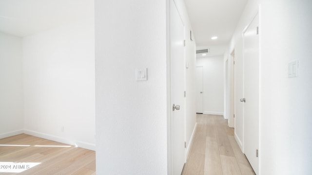 hallway featuring light hardwood / wood-style flooring